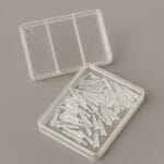 وج شفاف شیشه‌ای دندانپزشکی در جعبه برای ترمیم و ماتریکس بند.